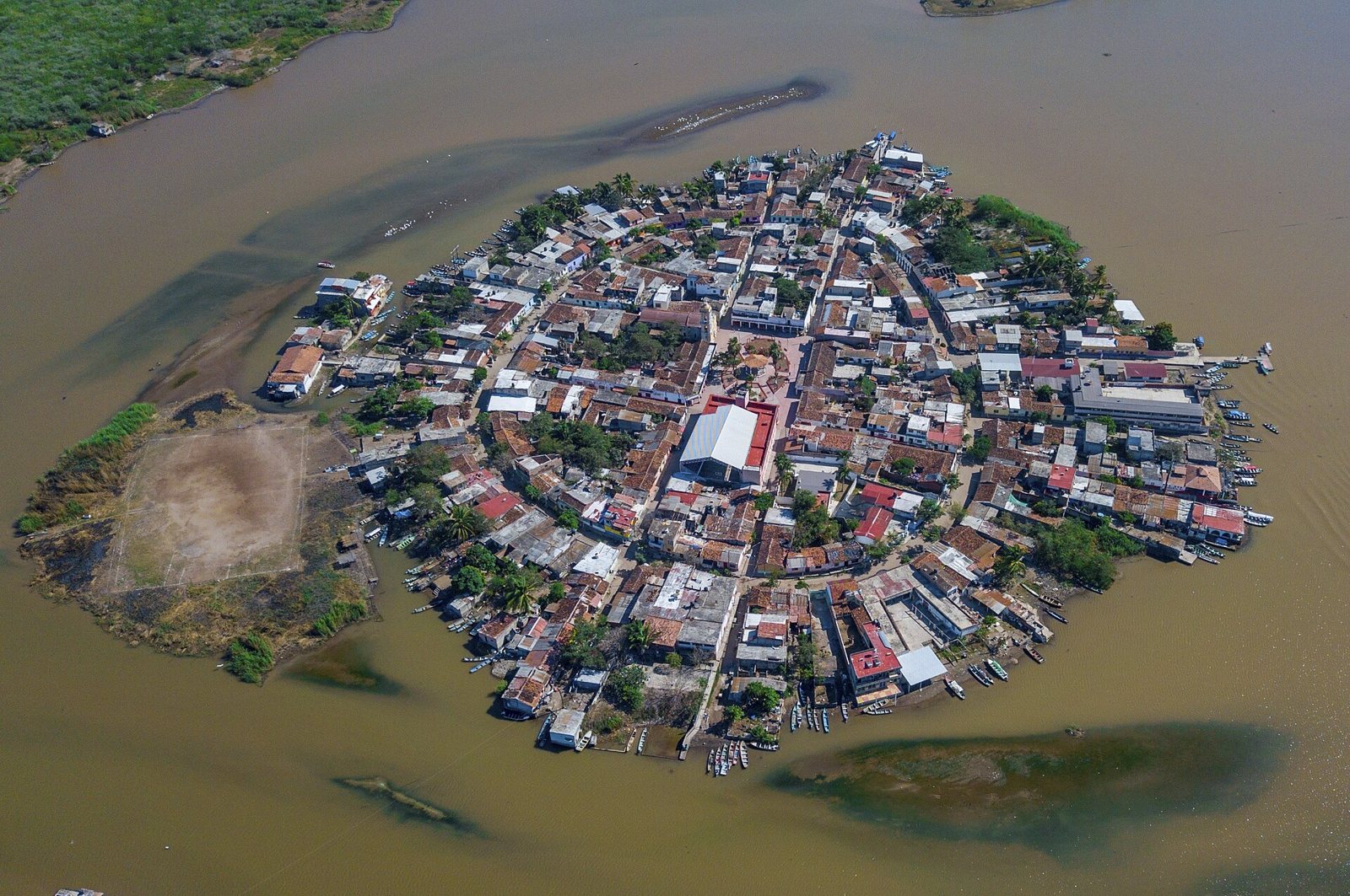 Aerial view of Mexcaltitán, a compact island town surrounded by lagoon waters