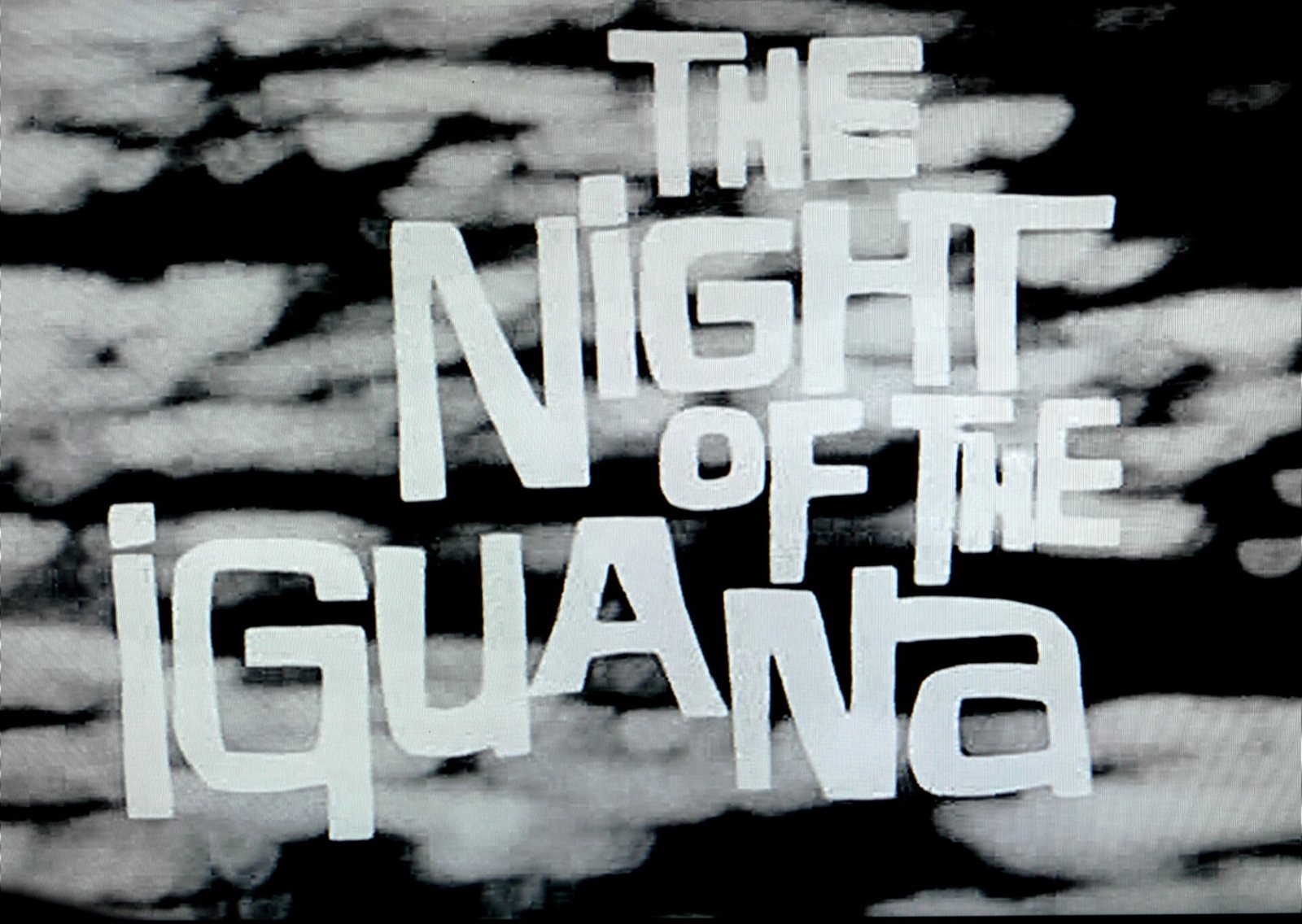 The Night of the Iguana title card in white lettering on a black-and-white background
