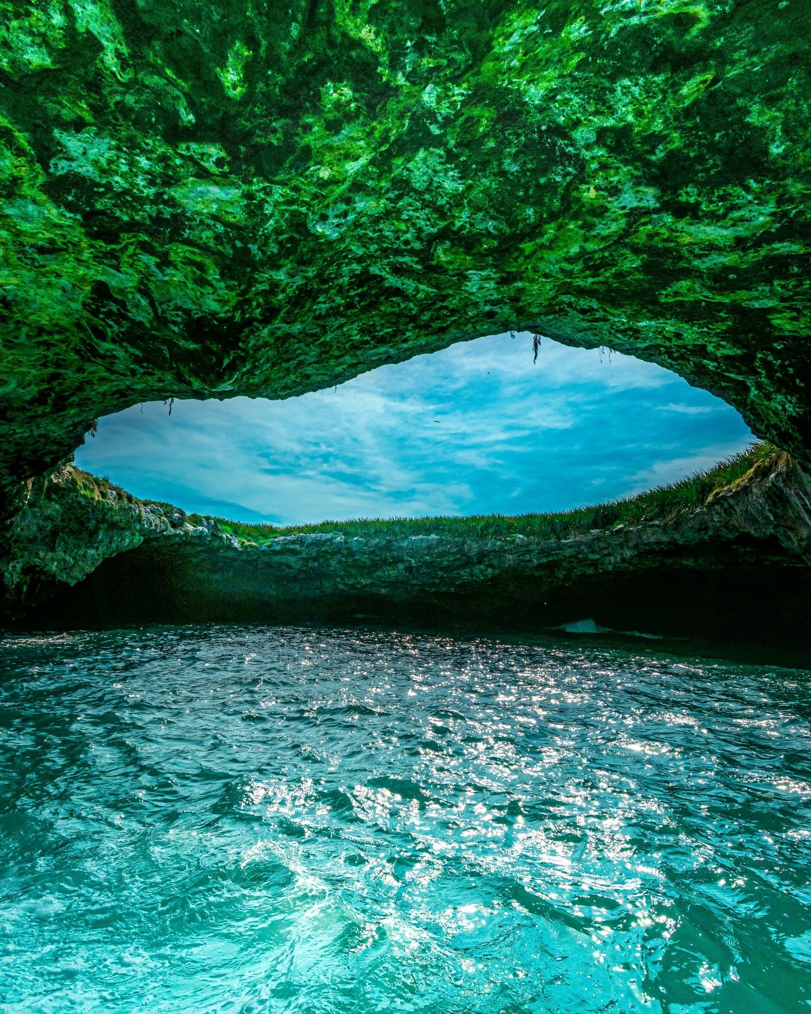 View from inside the cave toward Hidden Beach, with turquoise water